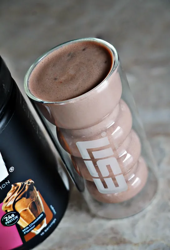 ESN Designer Protein Extra Creamy – Milk Chocolate, as a shake in a glass