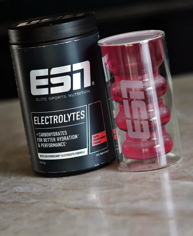ESN HydroLoad Electrolytes – Salty Watermelon, with a glass